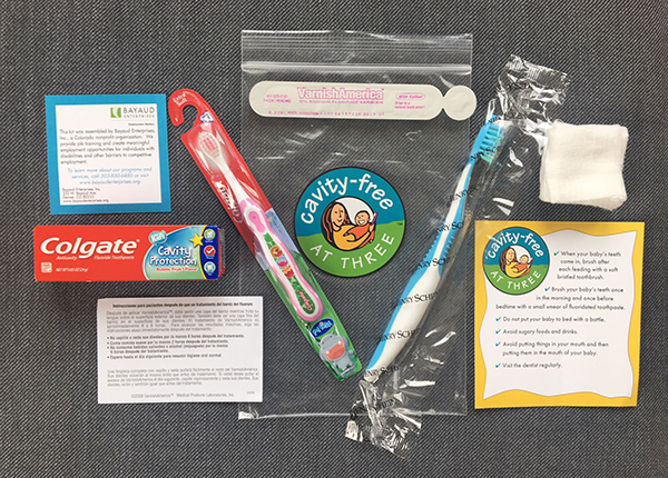 The contents of a CF3 kit - toothbrushes fluoride varnish and more