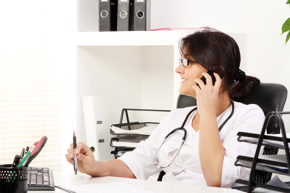 Woman in medical office on the phone