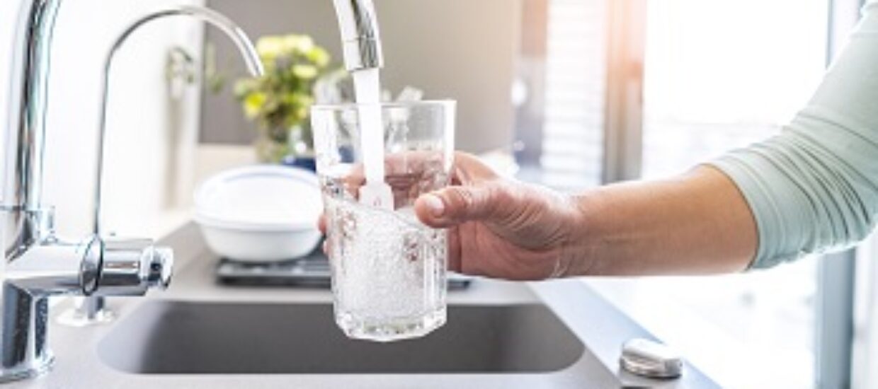 Filling glass of water from the tap