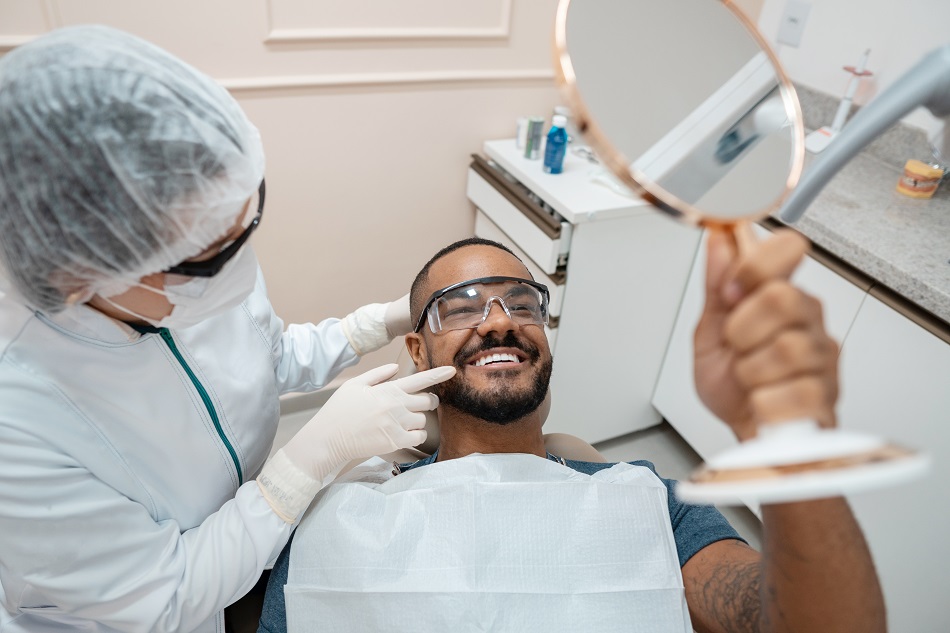 Patient checking the result of dental treatment